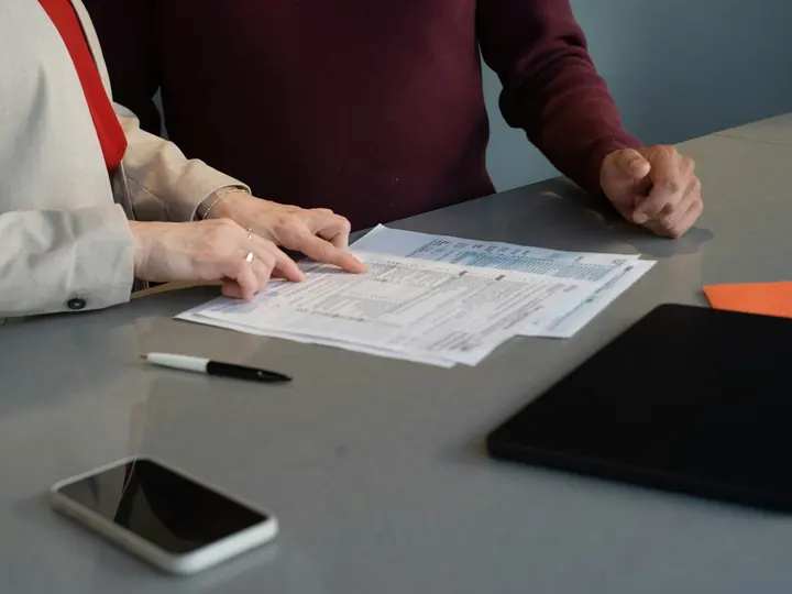 Financial documents being reviewed during a consultation